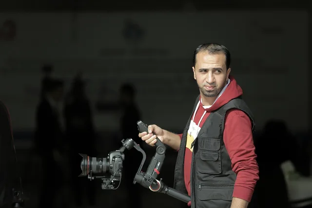 man, camera, press, young, news, work, job, film, portrait. How to market a local service business with video on a small budget